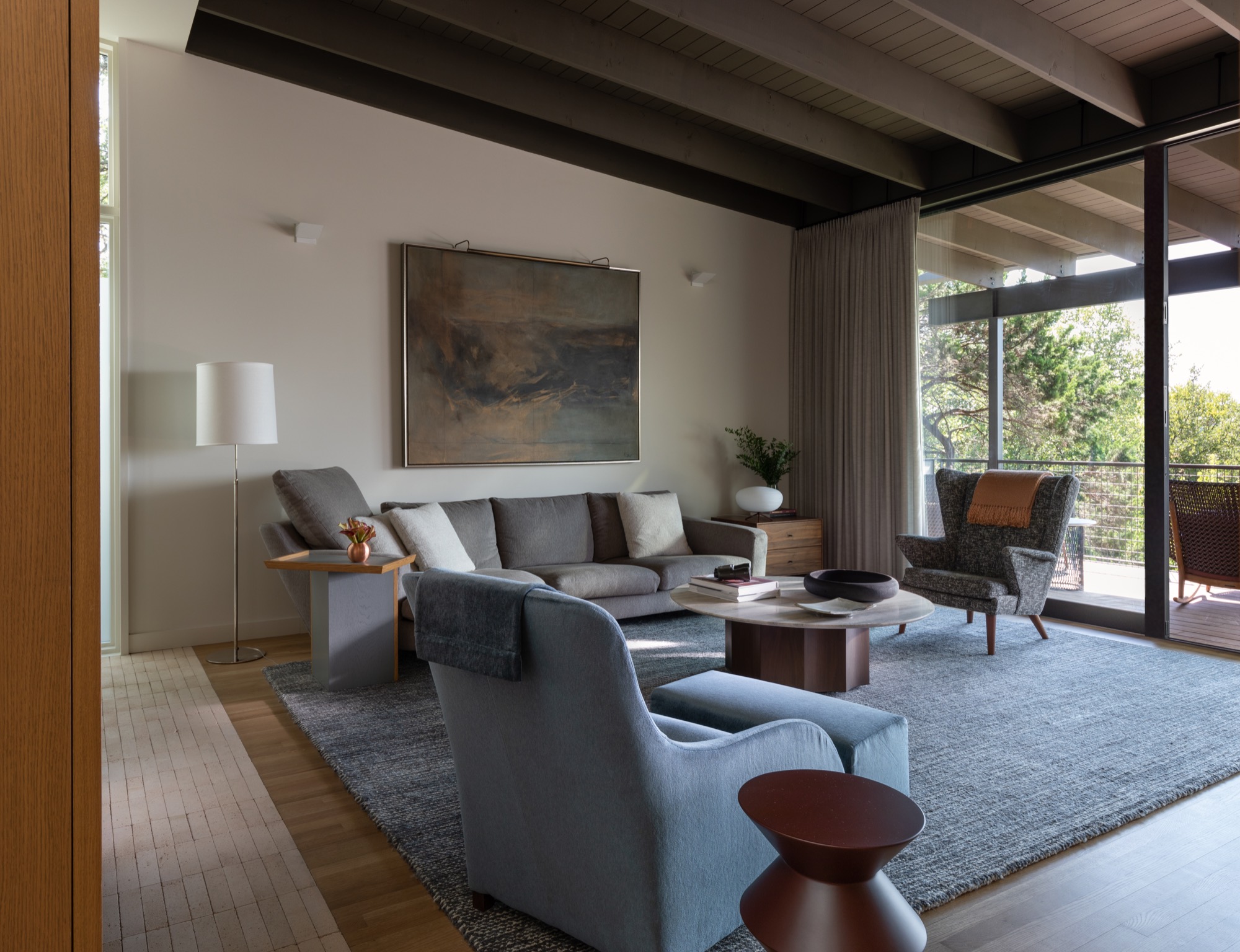 Living room of a modern Austin house opening to a terrace